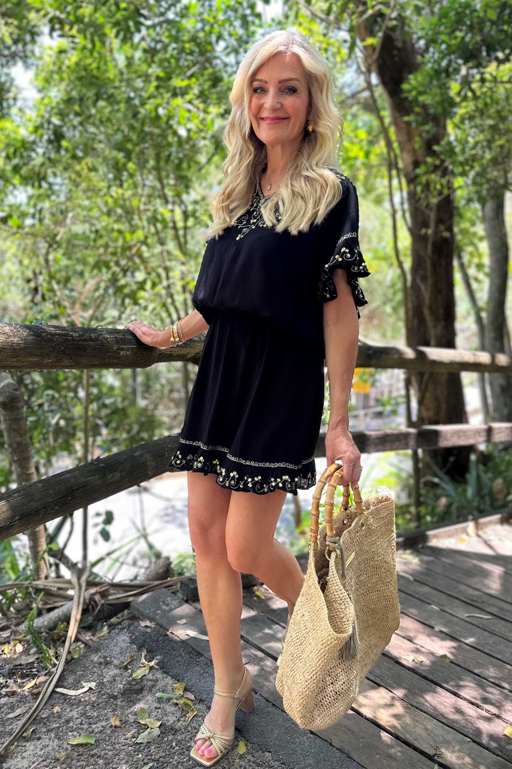 Black cotton blouson beach dress to wear on holiday by Lindsey Brown resort wear