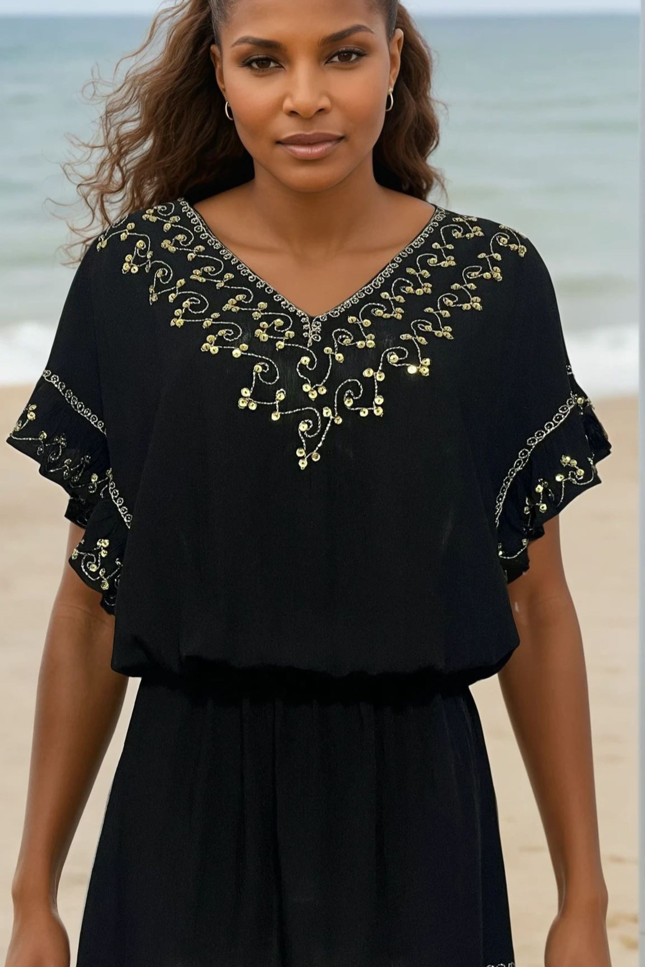 Black cotton drop waisted beach dresses to be worn on holiday by Lindsey Brown resort wear