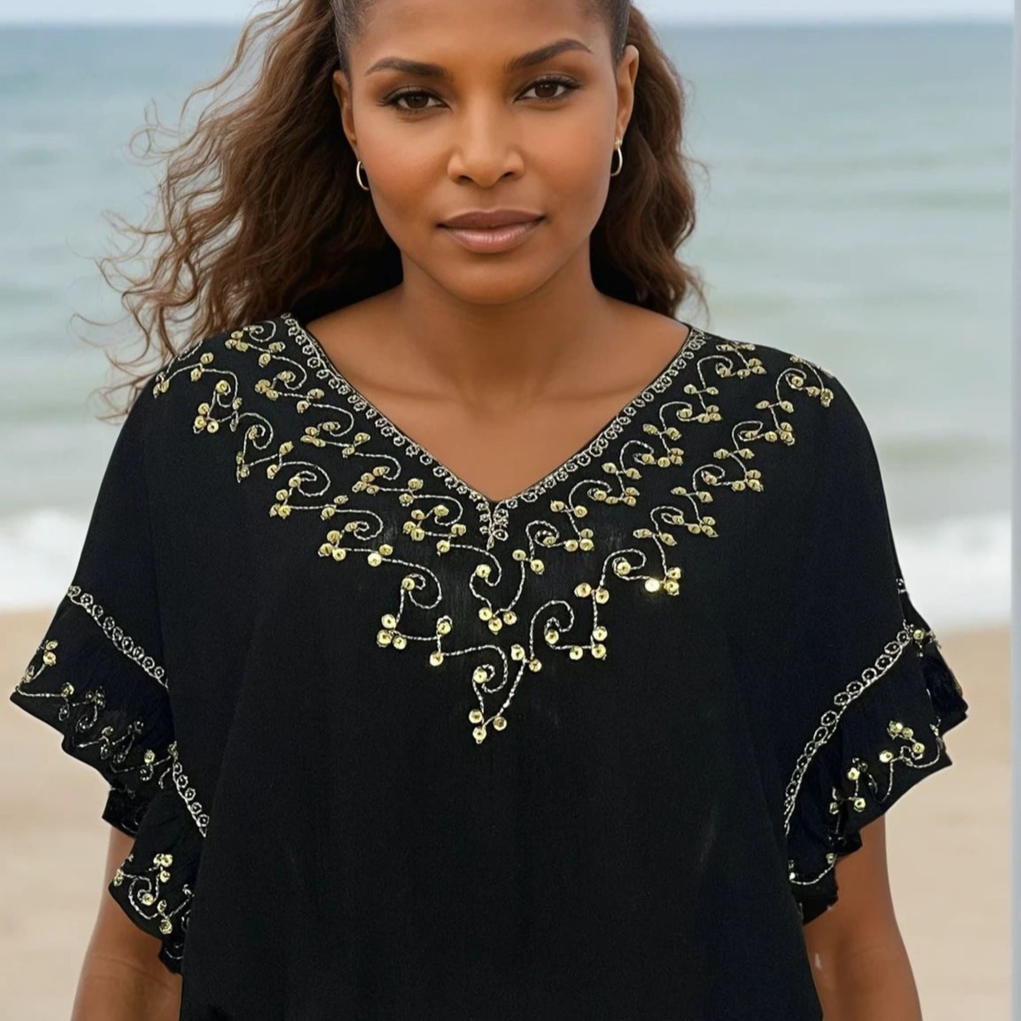 Black cotton drop waisted beach dresses to be worn on holiday by Lindsey Brown resort wear