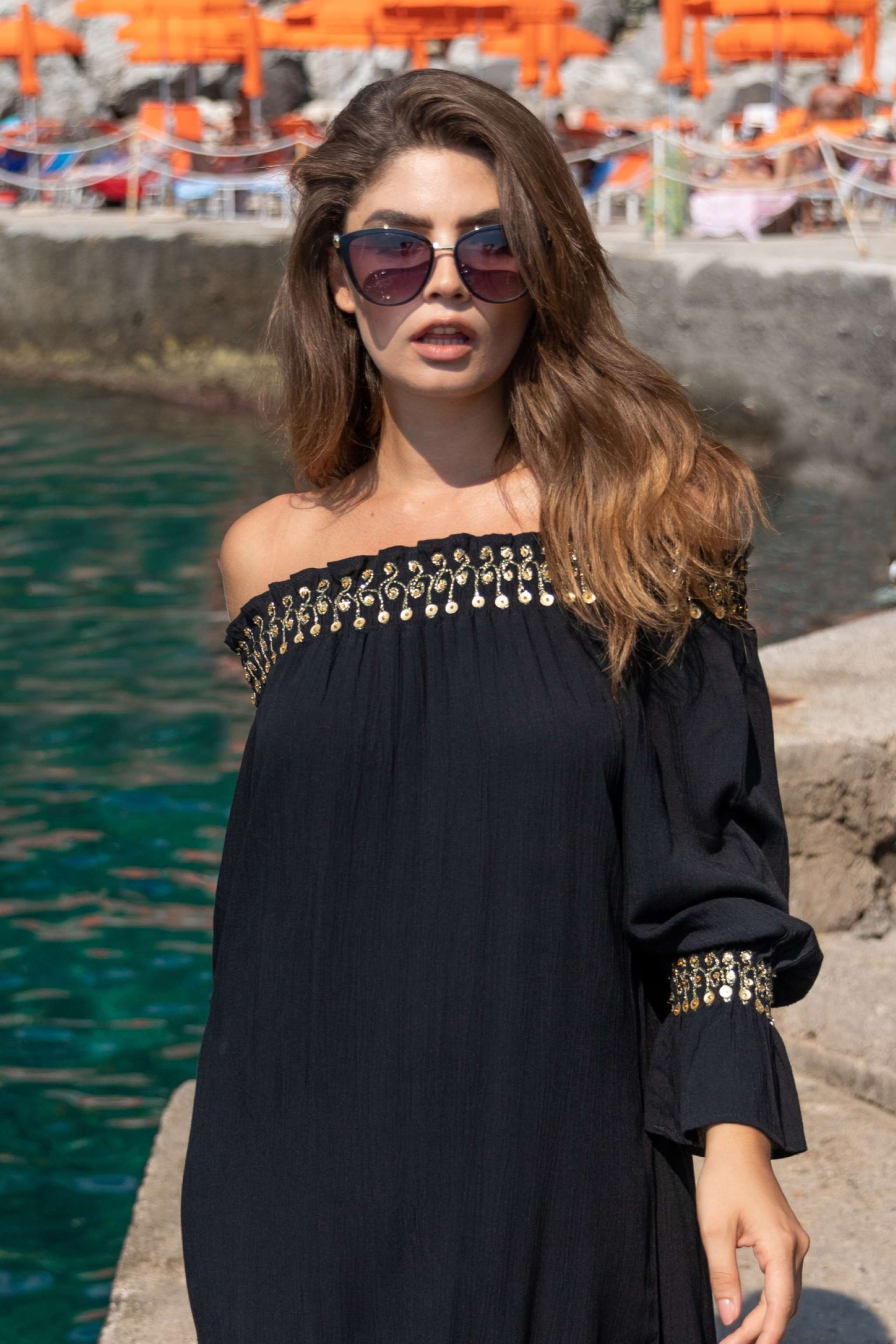 Black cotton off the shoulder holiday dresses in floaty black cotton by Lindsey Brown cotton resort wear 