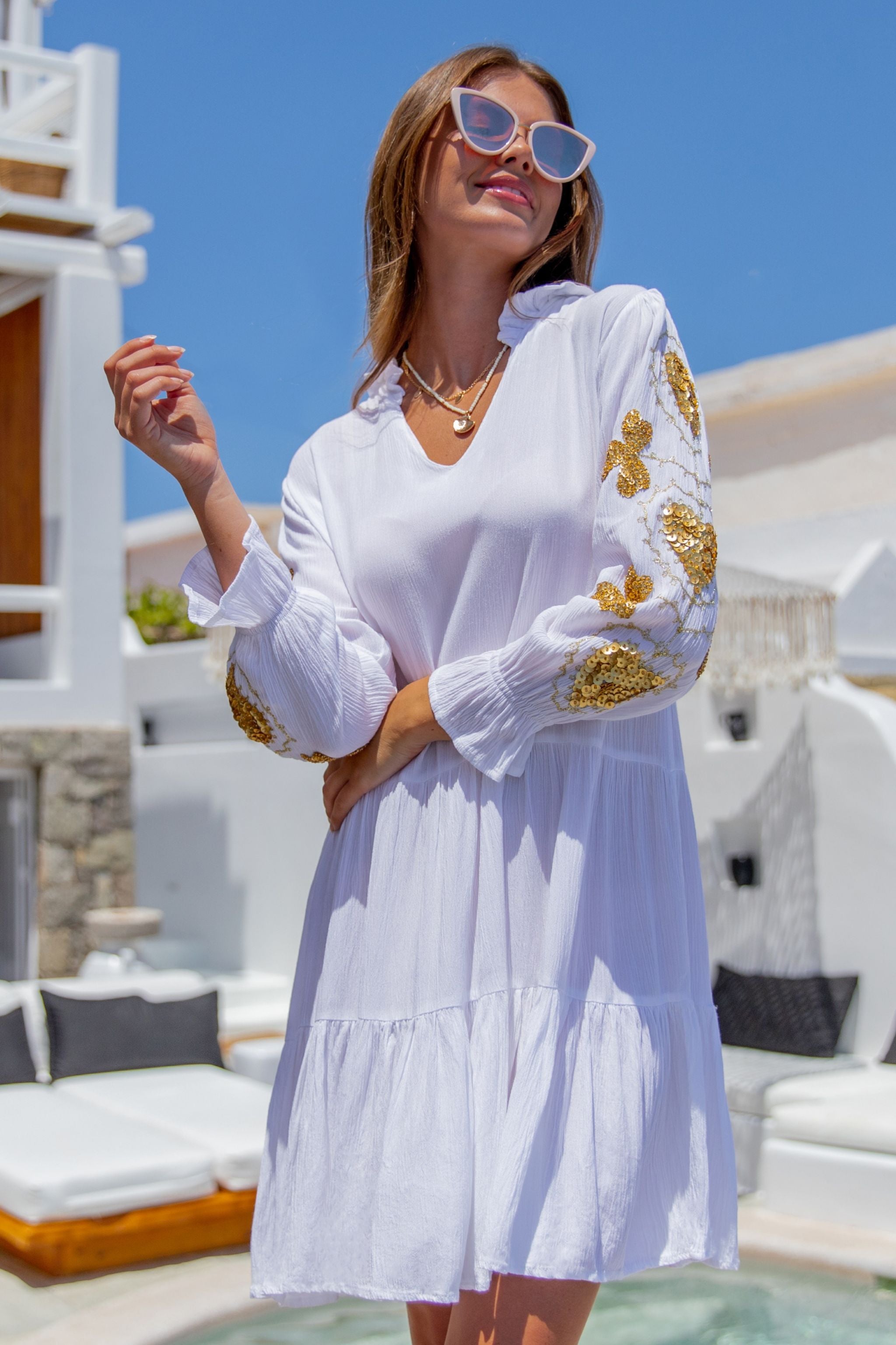 White and gold cotton beach dresses to wear on holiday by Lindsey Brown resort wear