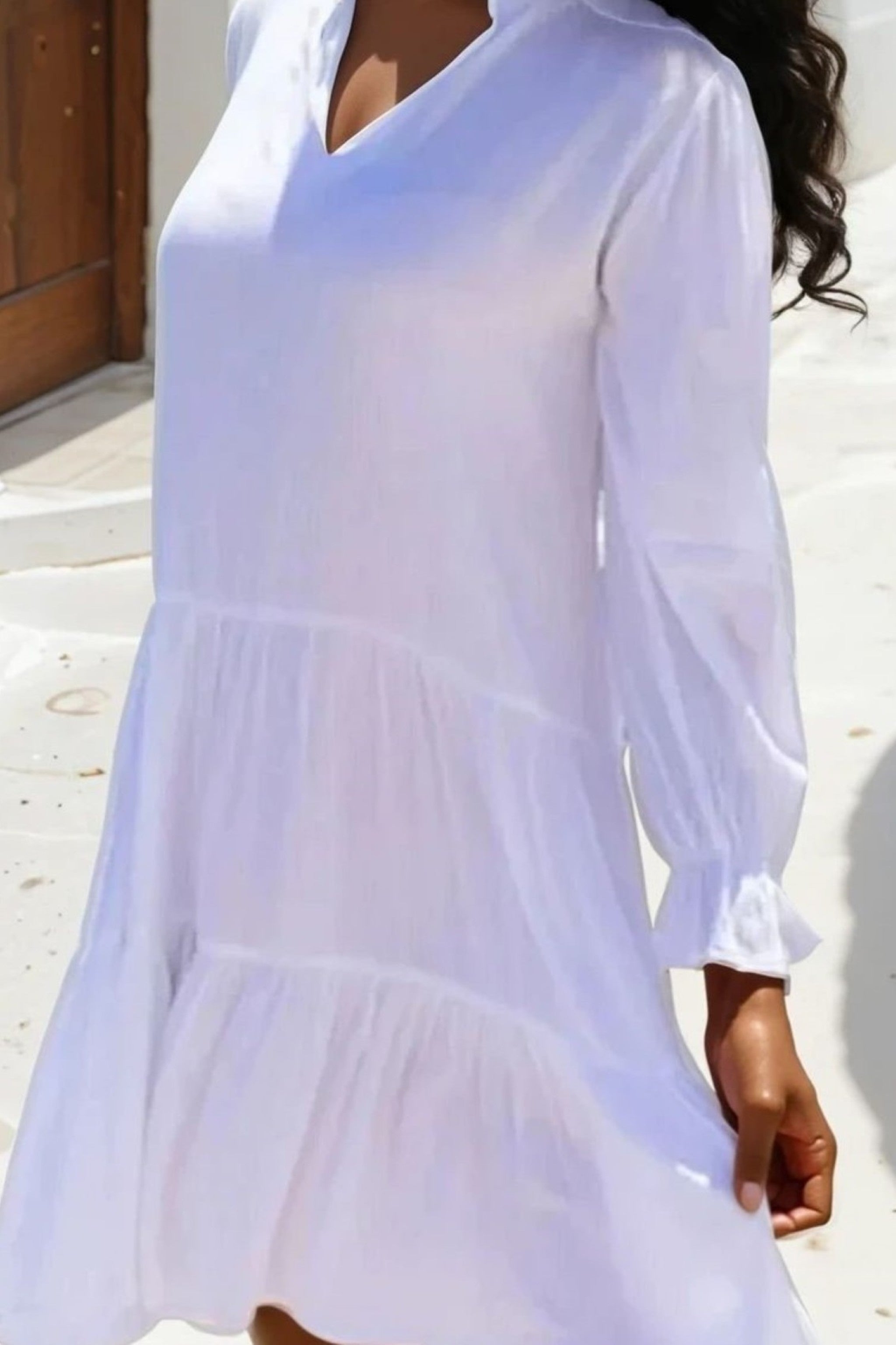 White cotton beach dress to wear on holiday by Lindsey Brown resort wear