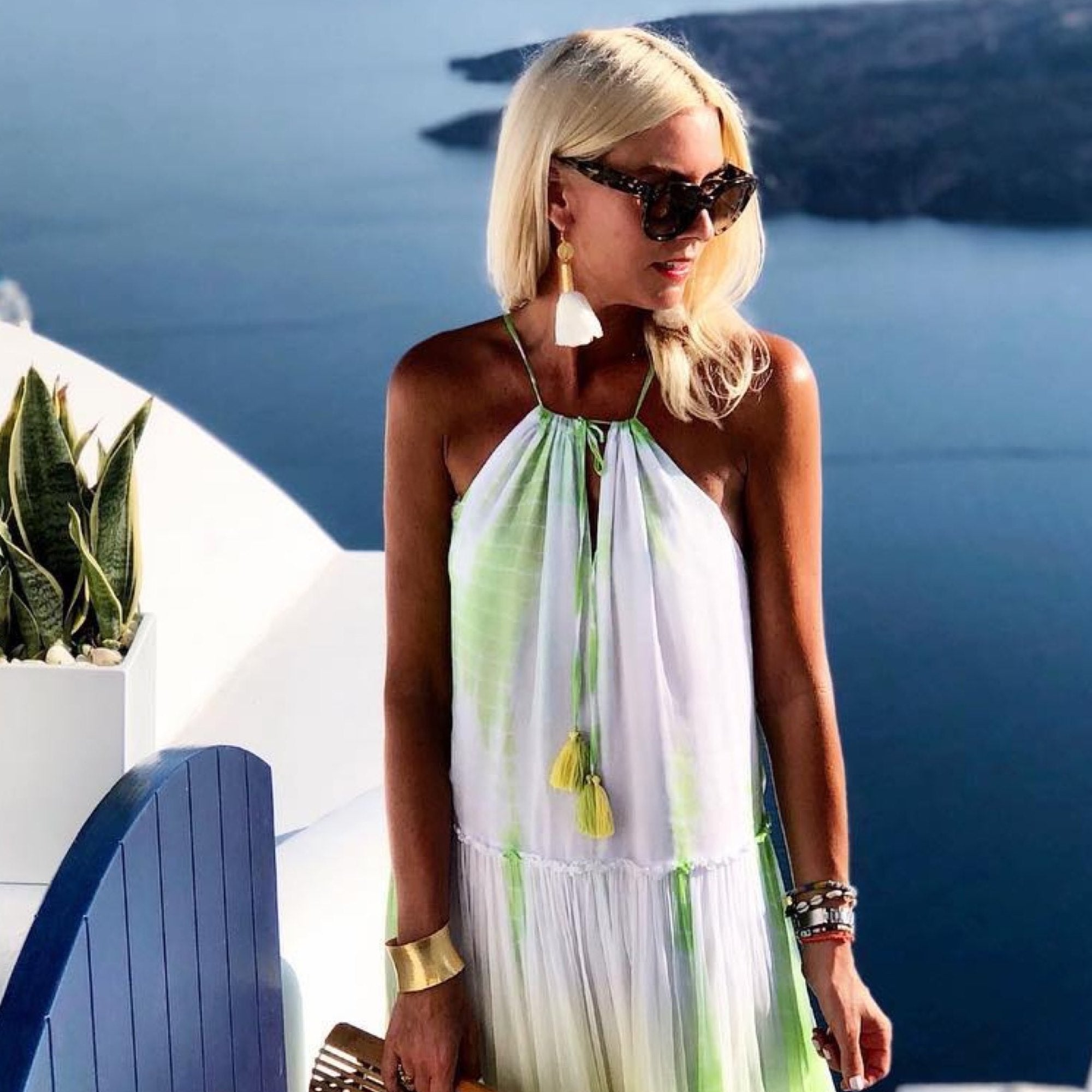 Yellow white silk resort wear dresses to wear in Santorini by Lindsey Brown luxury resort wear