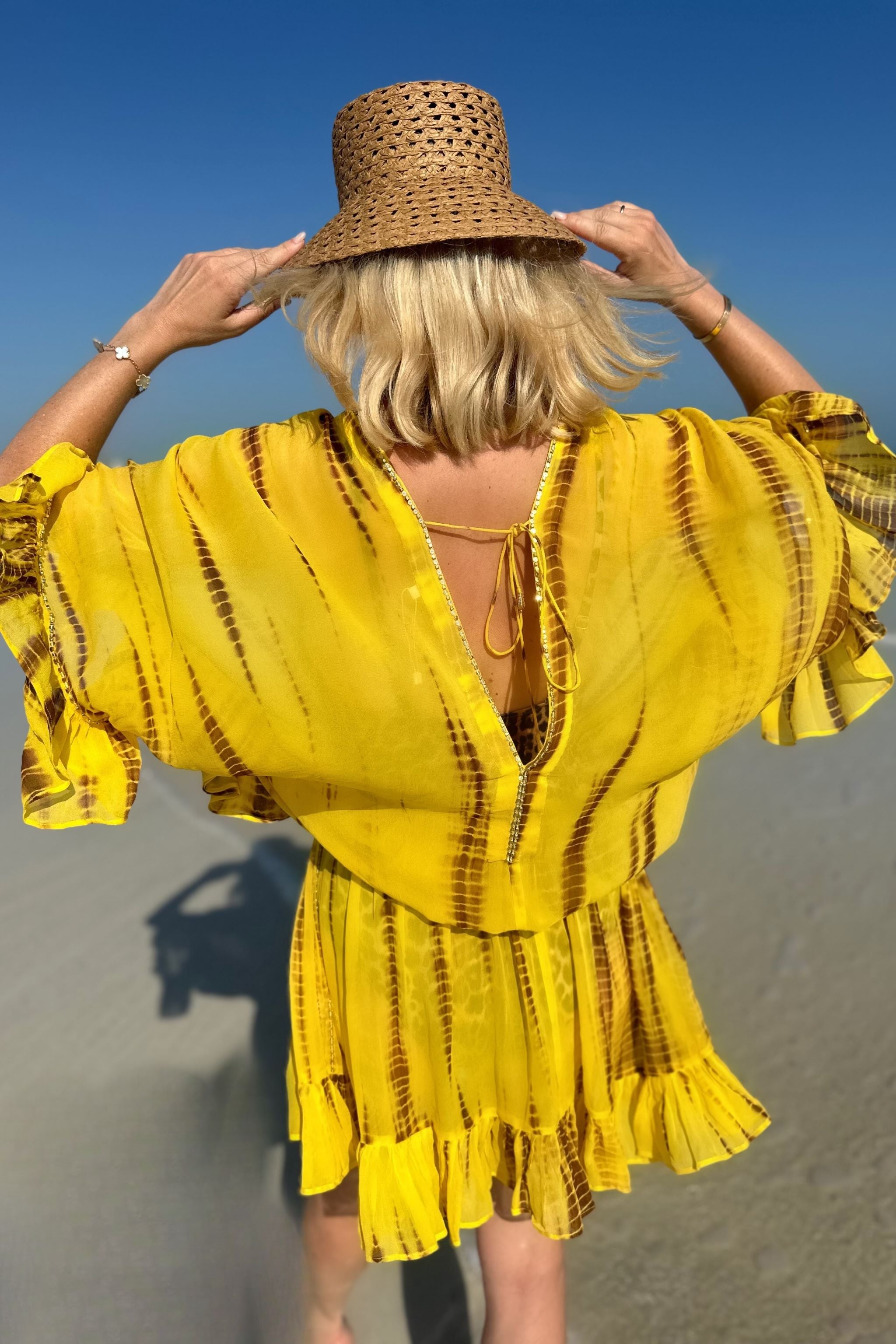 Yellow silk kaftan dress to wear in Mykonos by Lindsey Brown resort wear